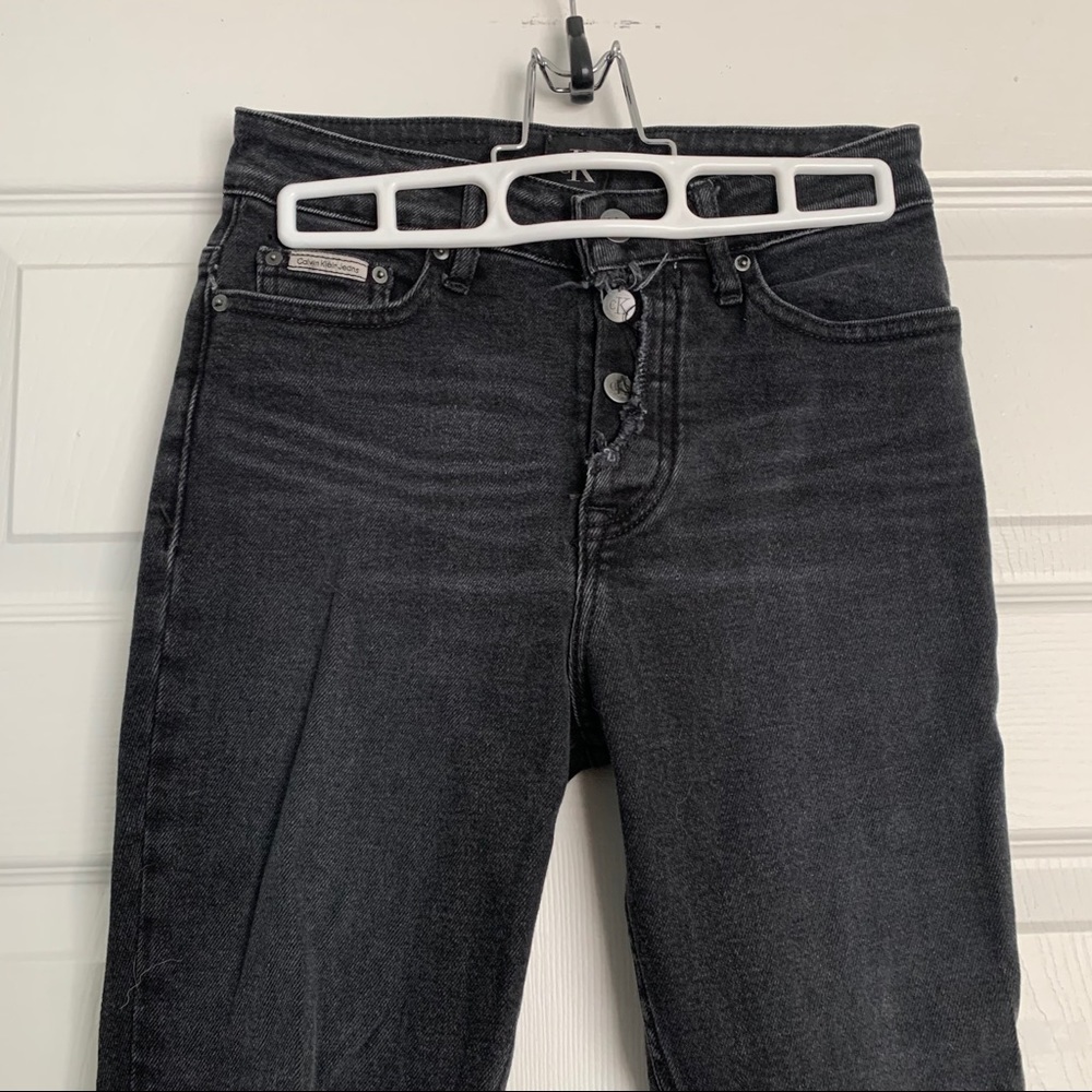 Calvin Klein Exposes Button Jeans